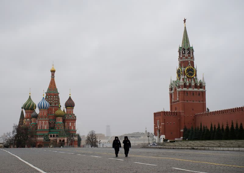 FILE PHOTO: Police officers walk along the Red Square in Moscow