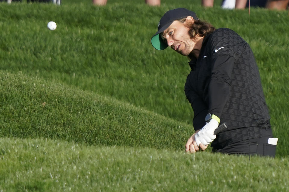 Tommy Fleetwood, of England, hits to the green on the 9th hole during the first round of play in The Players Championship golf tournament Thursday, March 10, 2022, in Ponte Vedra Beach, Fla. (AP Photo/Lynne Sladky)