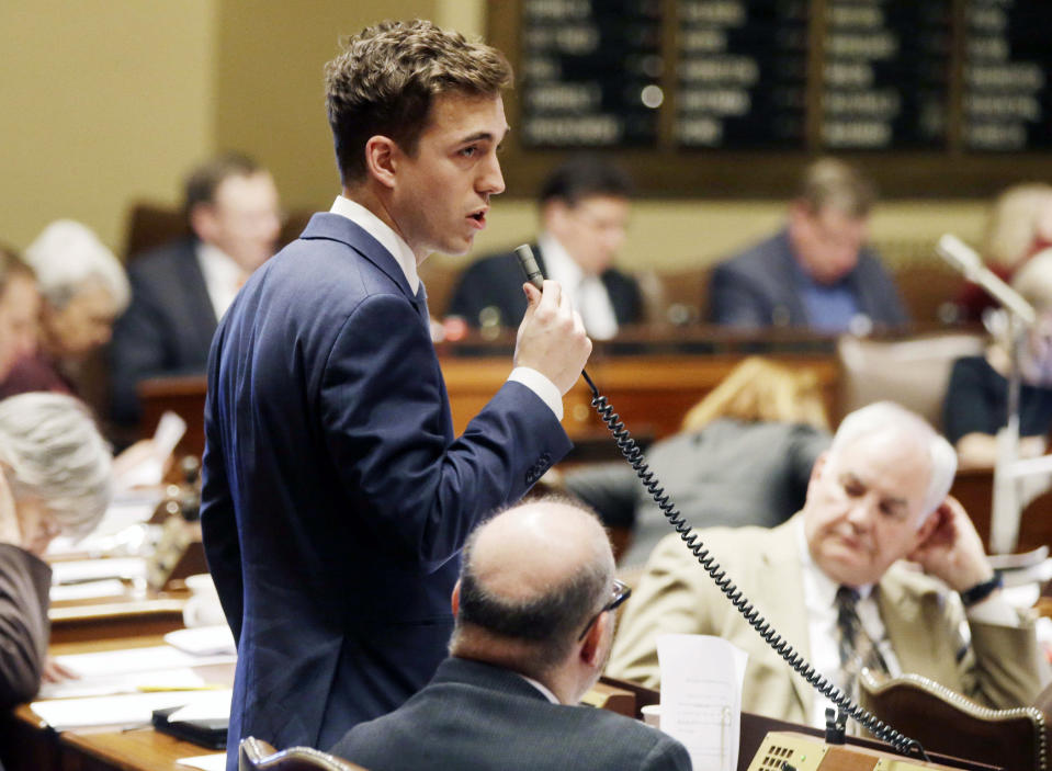 FILE - In this Feb 25, 2014, file photo, Rep. Joe Radinovich, Democrat from Crosby, addresses fellow lawmakers in St. Paul, Minn. A Republican super PAC is attacking Radinovich in a new ad launched Wednesday, Sept. 12, 2018, that characterizes the Minnesota House candidate's prior violations such as speeding, driving with a suspended license and parking tickets as "crimes" and says he spent his life running from the law. (AP Photo/Jim Mone, File)