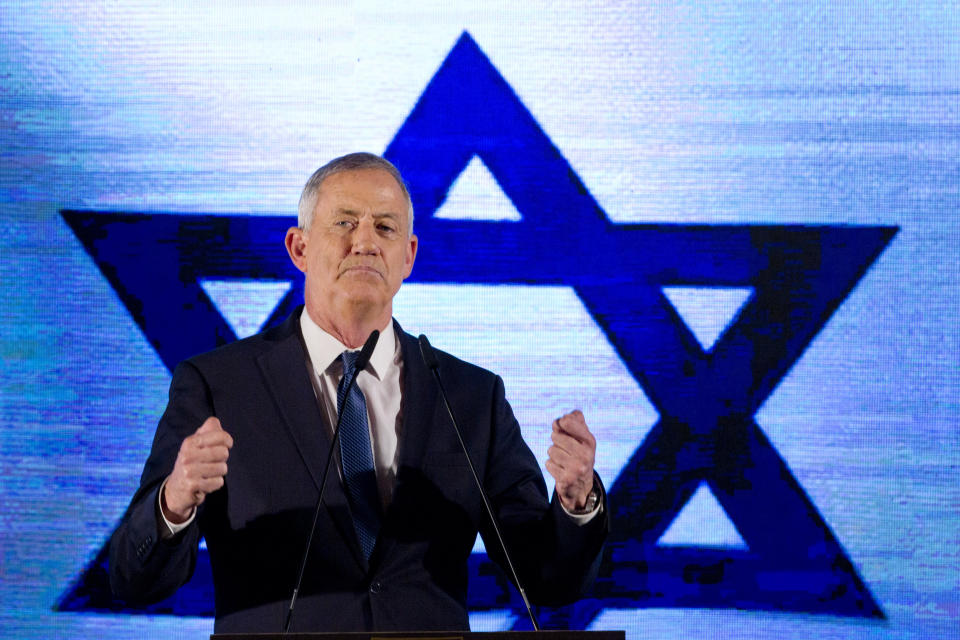 Blue and White party leader Benny Gantz gestures as he speaks during an election campaign rally to his supporters in Tel Aviv, Israel, Sunday, April 7, 2019. (AP Photo/Sebastian Scheiner)