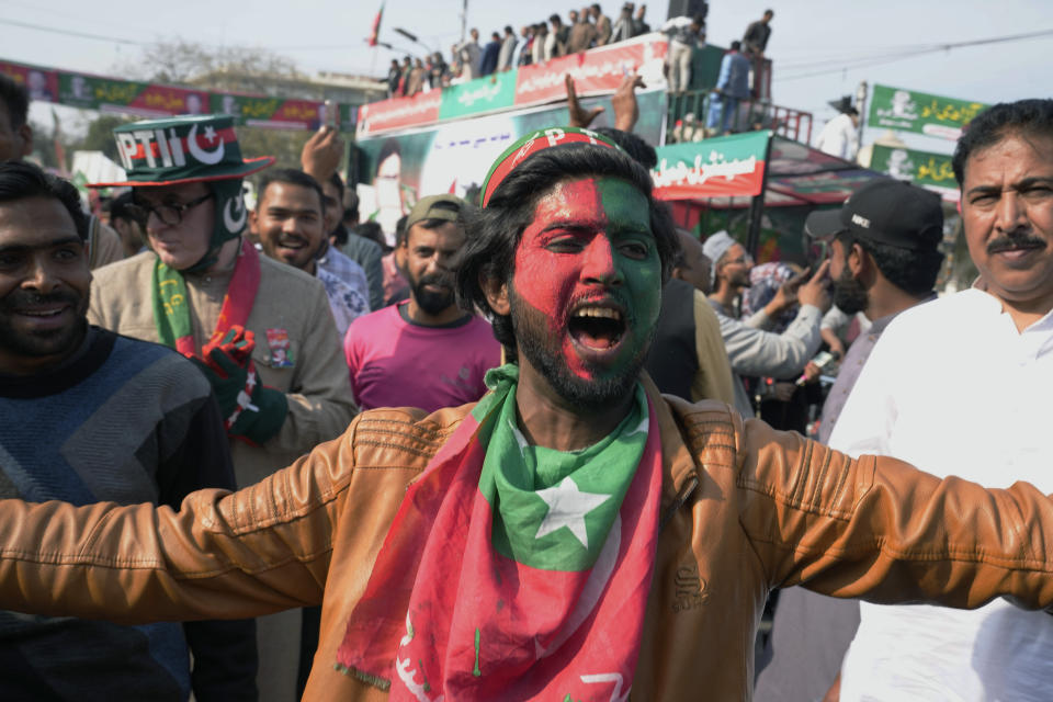 Supporters of Pakistan's former prime minister Imran Khan's 'Pakistan Tehreek-e-Insaf' party participate in a rally, in Lahore, Pakistan, Wednesday, Feb. 22, 2023. Hundreds of supporters of Pakistan's former prime minister on Wednesday defied a ban on rallies in a commercial area of the city of Lahore, taunting police and asking to be arrested en masse. (AP Photo/K.M. Chaudary)