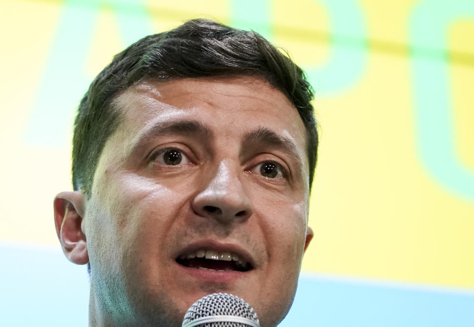 Ukrainian President Volodymyr Zelenskiy speaks to the media at his party's headquarters after a parliamentary election in Kiev, Ukraine, Sunday, July 21, 2019. Zelenskiy's party took the largest share of votes in the country's snap parliamentary election, an exit poll showed Sunday. (AP Photo/Evgeniy Maloletka)