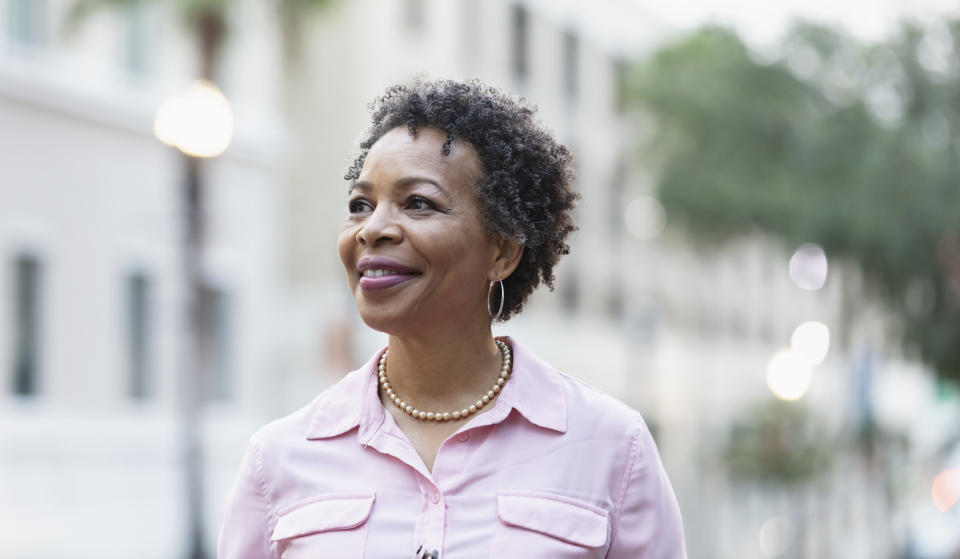 A woman smiling