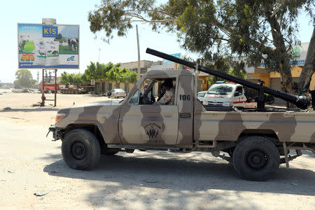 Members of Libyan internationally recognised government forces are seen at Al-Swani area in Tripoli, Libya April 18, 2019. REUTERS/Ahmed Jadallah