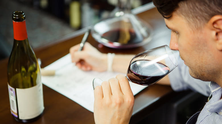 Evaluating wine and taking notes