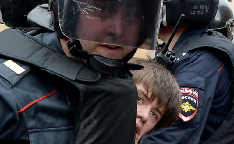 Police detain a protester in Russia's second city Saint Petersburg, where a largely young crowd of around 1,000 people shouted "shame"