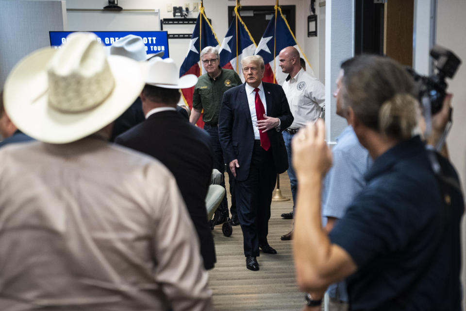 Former President Donald J. Trump and Texas Governor Greg Abbott depart after a security briefing with state officials and law enforcement at the Weslaco Department of Public Safety DPS Headquarters before touring the US-Mexico border wall on Wednesday, June 30, 2021 in Weslaco, Texas. (Jabin Botsford/The Washington Post via AP, Pool)