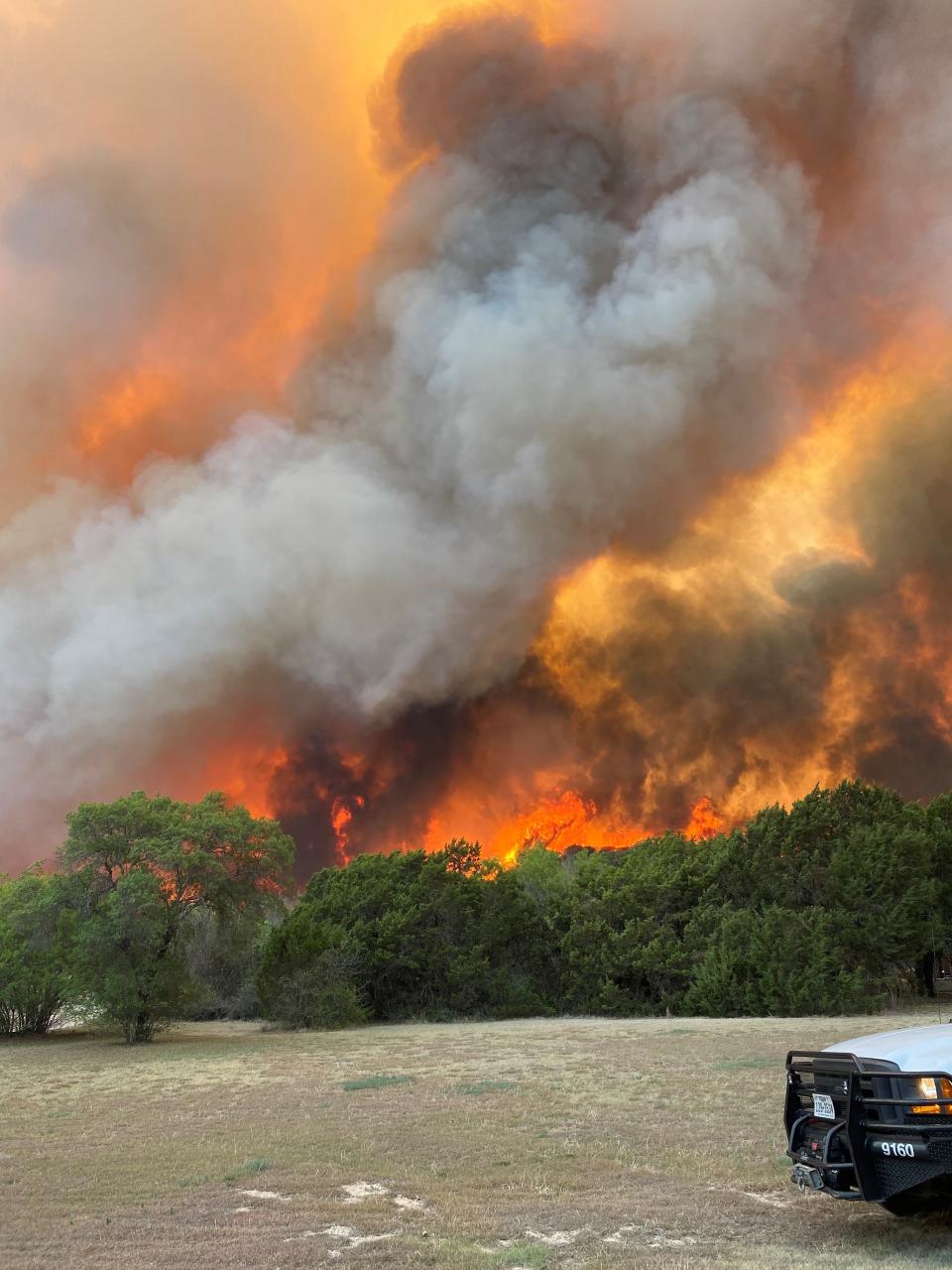 Flames and smoke rise high above the trees in the Mesquite Heat Fire, which started near View on Tuesday, May 17.