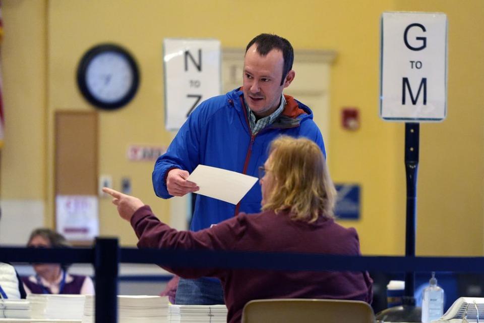 A voter checks in at the polling station in Kennebunk, Maine, Tuesday, March 5, 2024.  Super Tuesday elections are being held in 16 states and one territory. Hundreds of delegates are at stake, the biggest haul for either party on a single day.  (AP Photo/Michael Dwyer)