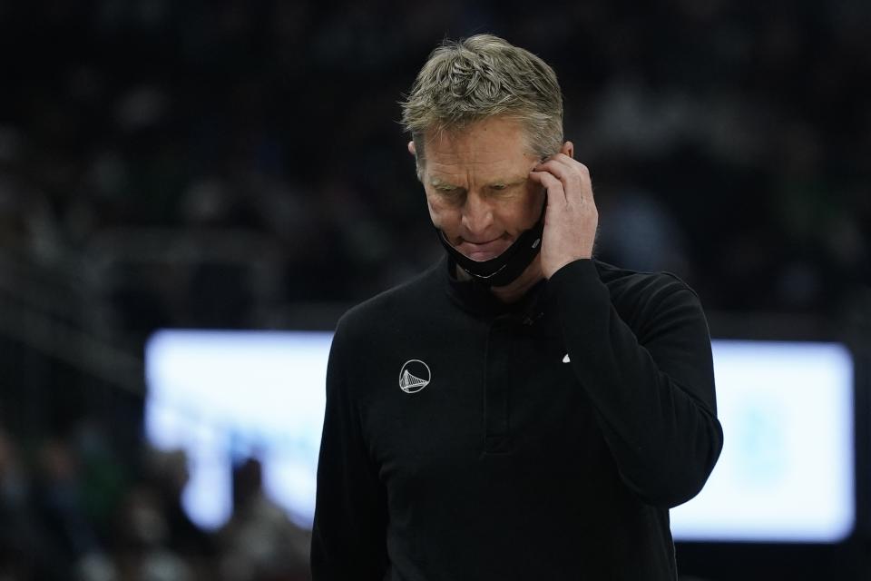 Golden State Warriors head coach Steve Kerr sctarches his head during the first half of an NBA basketball game against the Milwaukee Bucks Thursday, Jan. 13, 2022, in Milwaukee. (AP Photo/Morry Gash)