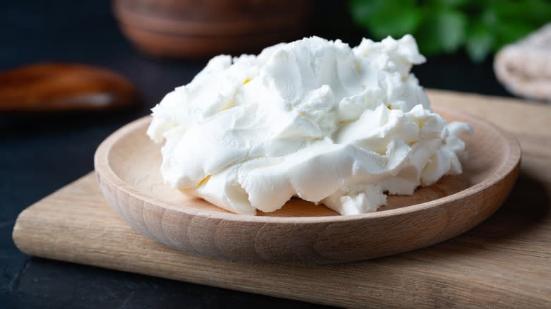 Cottage cheese in wooden dish