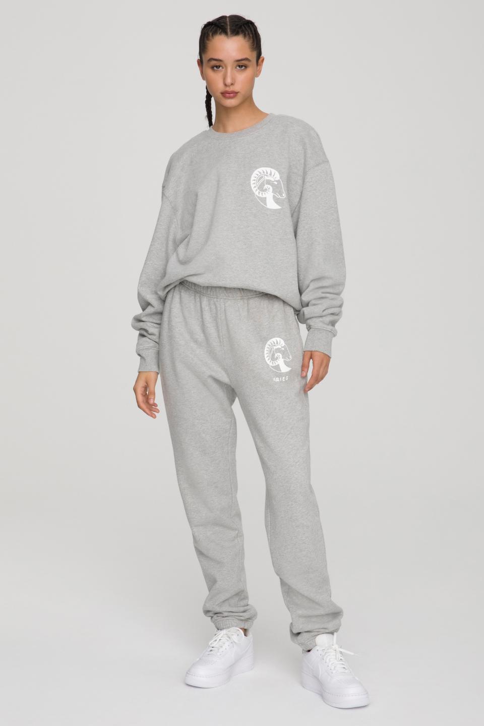 Koutrney Kardashian posed in the Aries Boyfriend Sweatshirt ($124) and Sweatpants  ($105) combo from Good American. 