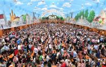 <p>Visitors celebrate in the ‘Bavarian heaven’ beer tent. (Getty Images/Joerg Koch) </p>