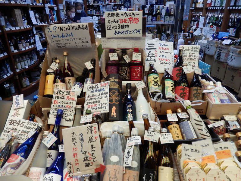 Yasuko Fujii works at her liquor store at Nishiki Market in Kyoto, Japan