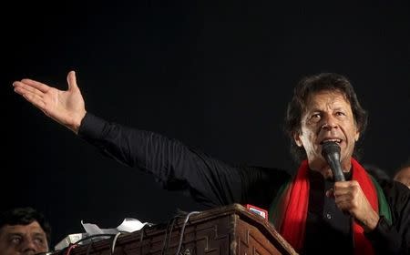 Imran Khan, cricketer-turned-politician and chairman of the Pakistan Tehreek-e-Insaf (PTI) political party addresses his supporters during a by-election campaign rally in Lahore, Pakistan, October 9, 2015. REUTERS/Mohsin Raza