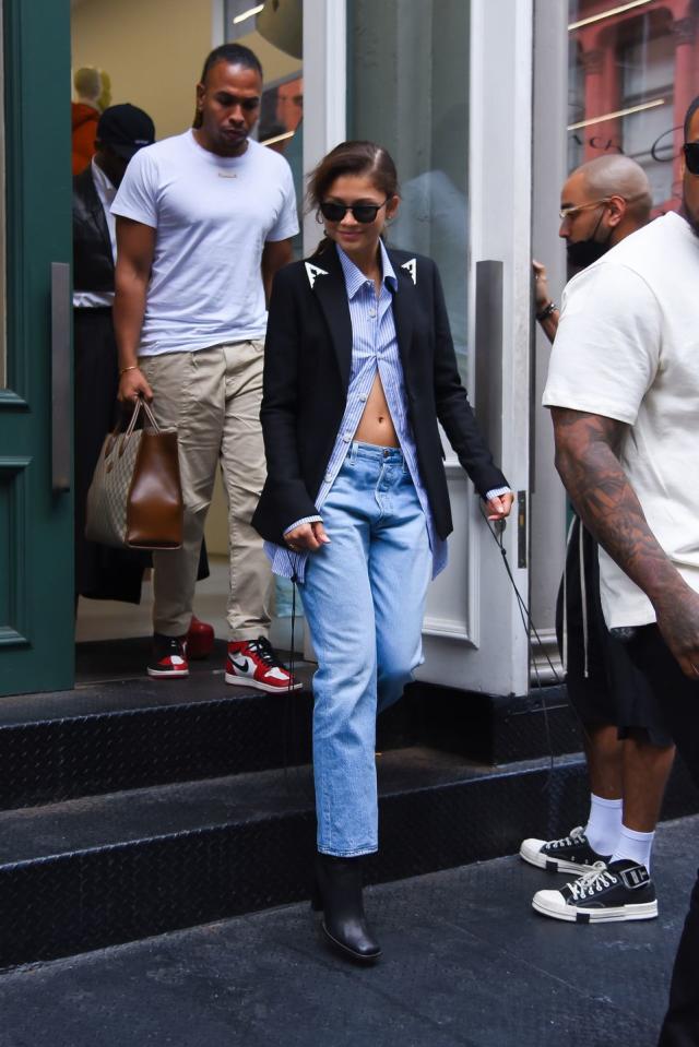 Zendaya keeps it simple in a black shirt and blue jeans while stepping out  for lunch with her assistant in Los Angeles-250523_4