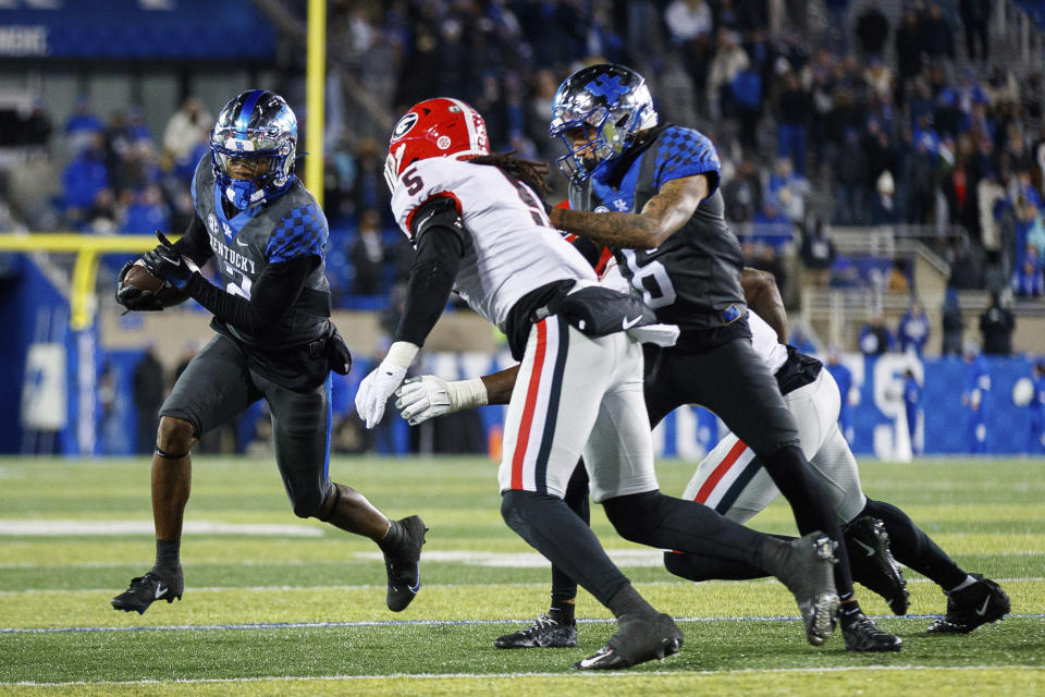 Kentucky wide receiver Barion Brown (2) runs the ball down the field while being chased by Georgia defensive back Kelee Ringo (5) during the second half of an NCAA college football game in Lexington, Ky., Saturday, Nov. 19, 2022. (AP Photo/Michael Clubb)