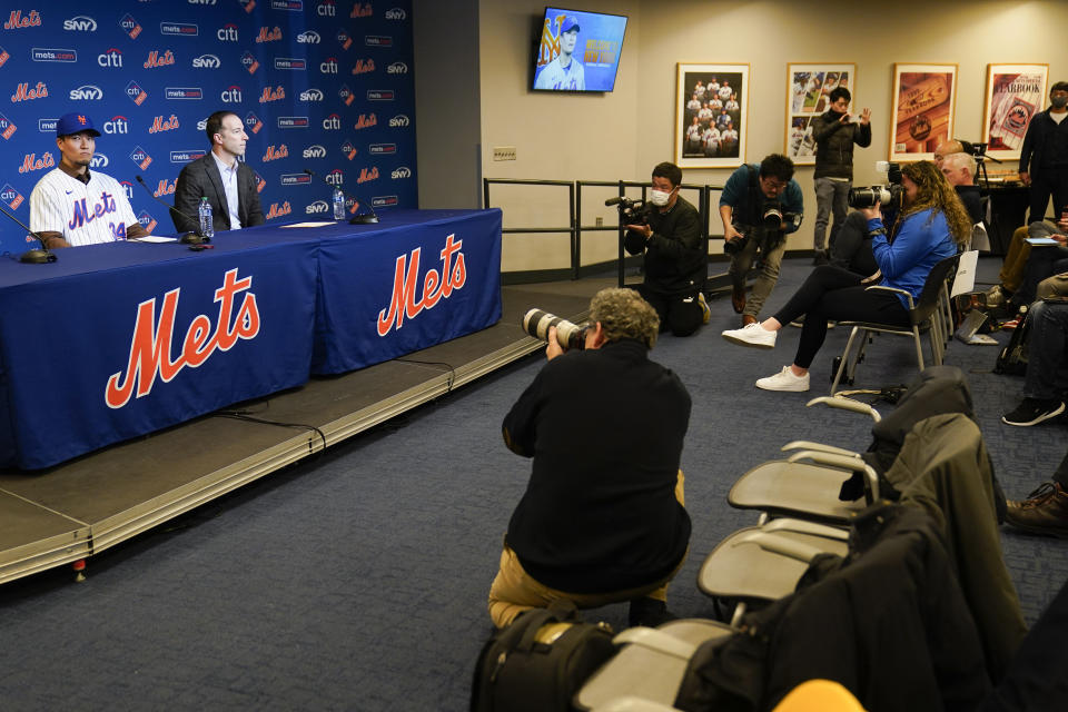 Kodai Senga, left, attends a news conference at Citi Field, Monday, Dec. 19, 2022, in New York. The Japanese pitcher and the New York Mets baseball team have finalized a $75 million, five-year contract. (AP Photo/Seth Wenig)