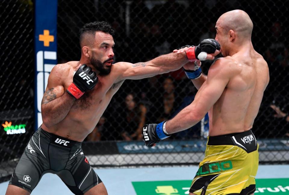 Rob Font flicks out a jab against Jose Aldo (Zuffa LLC)