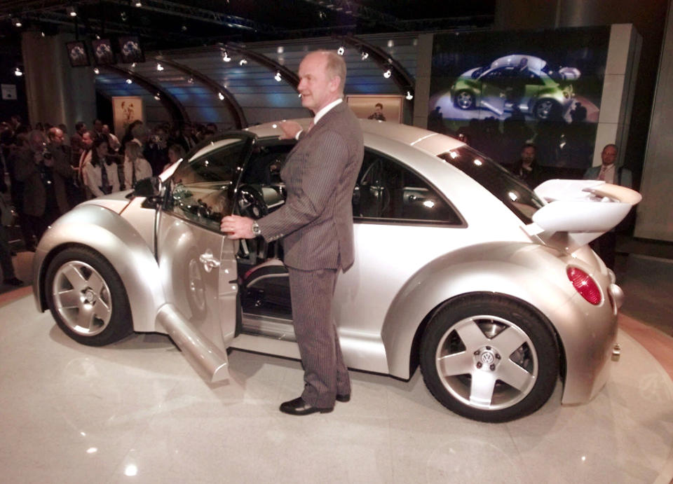 FILE - In this Monday, Jan. 4, 1999 file photo Volkswagen AG chairman, Dr. Ferdinand Piech, poses next to the next generation Beetle at the North American International Auto Show in Detroit. (AP Photo/Carlos Osorio, File)