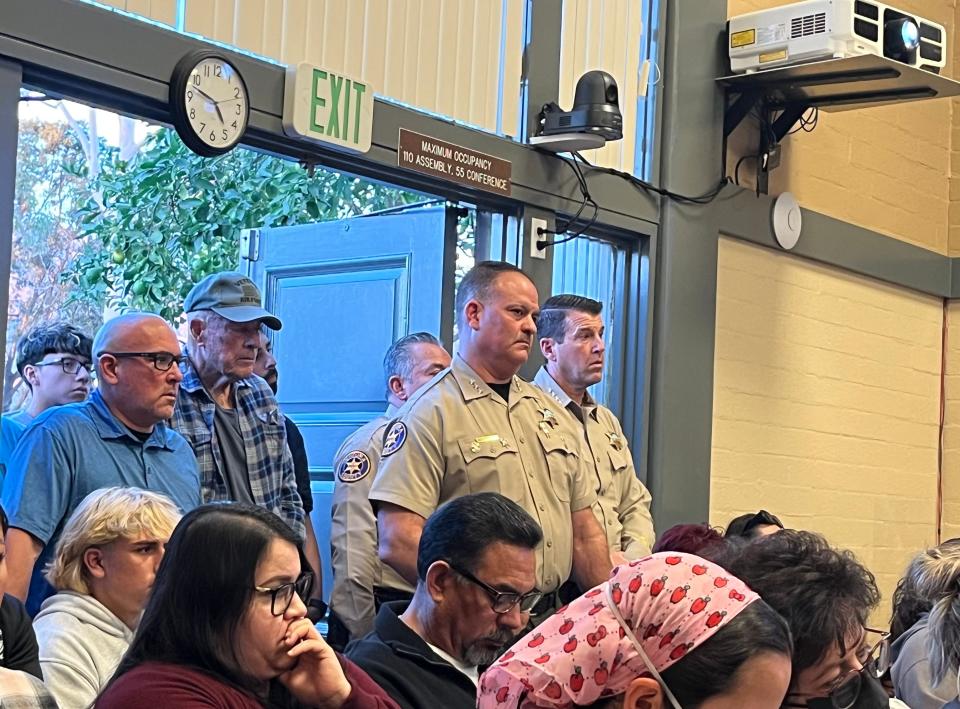 Ventura County Sheriff Jim Fryhoff, far right, stands in the back of the Santa Paula City Council meeting on Nov. 8. The council was discussing the city's crisis in police staffing, with 10 officers planning to leave for jobs with the Sheriff's Office.