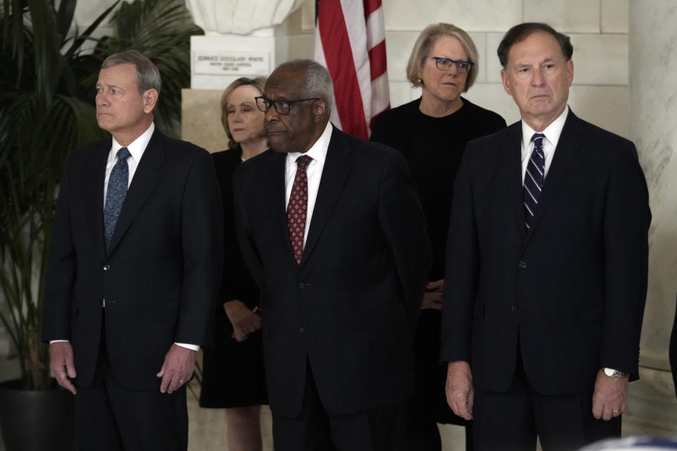 Chief Justice of the United States John Roberts, Justice Clarence Thomas and Justice Samuel Alito attend a private ceremony for retired Supreme Court Justice Sandra Day O'Connor before public repose in the Great Hall at the Supreme Court in Washington, Monday, Dec. 18, 2023. O'Connor, a Arizona native and the first woman to serve on the nation's highest court, died Dec. 1 at age 93. (AP Photo/Jacquelyn Martin, Pool)