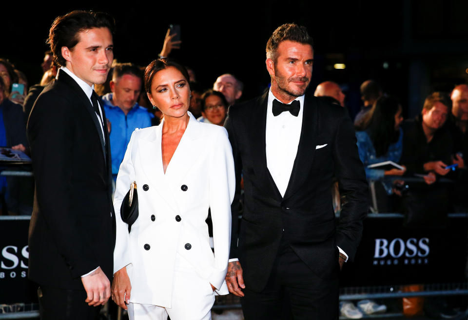 David Beckham, his wife Victoria Beckham and one of their sons, Brooklyn Beckham arrive to the GQ Men Of The Year Awards 2019 in London, Britain September 3, 2019. REUTERS/Henry Nicholls