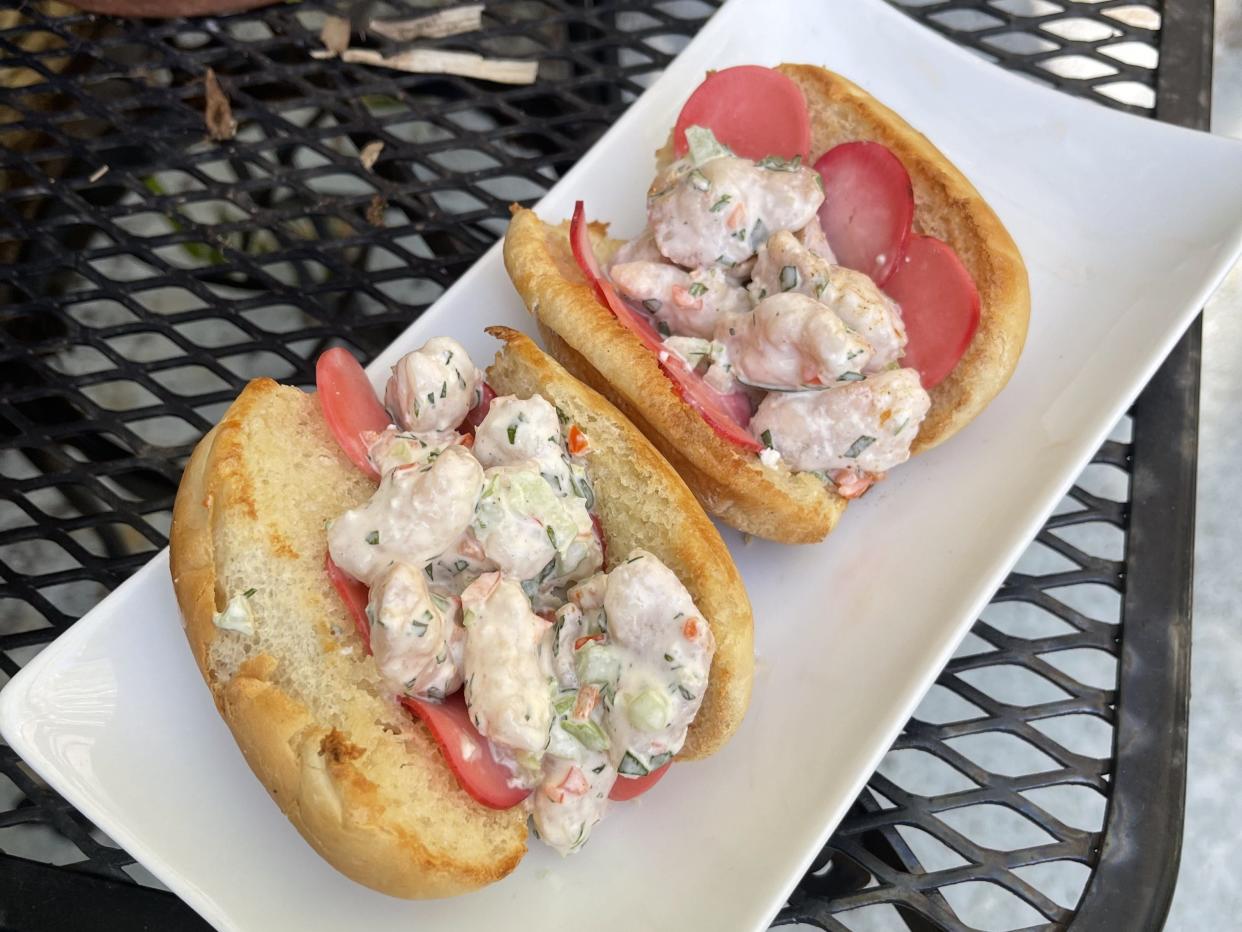 The menu at Salvador Deli at Walking Tree Brewery in Vero Beach features lobster rolls made with sustainable Norwegian lobster tail meat, accompanied by pickled daikon and assorted vegetables and served on a toasted bun.
