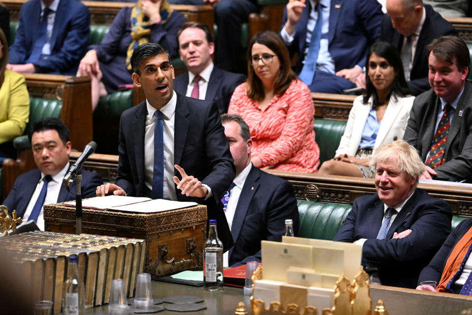 British Prime Minister Boris Johnson reacts as British Chancellor of the Exchequer Rishi Sunak delivers a statement at the House of Commons in London, Britain May 26, 2022. UK Parliament/Jessica Taylor/Handout via REUTERS ATTENTION EDITORS - THIS IMAGE HAS BEEN SUPPLIED BY A THIRD PARTY. MANDATORY CREDIT. IMAGE MUST NOT BE ALTERED.
