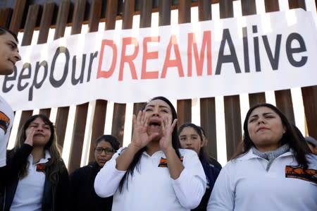 'Dreamers' react as they meet with relatives during the 'Keep Our Dream Alive' binational meeting at a new section of the border wall on the U.S.-Mexico border in Sunland Park