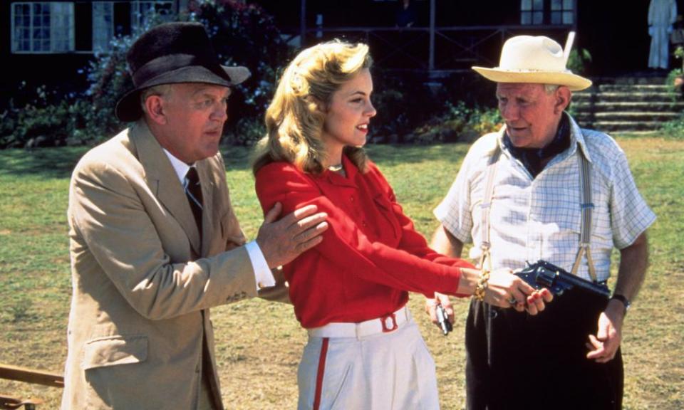 Joss Ackland, left, with Greta Scacchi and Trevor Howard in the 1987 film White Mischief.