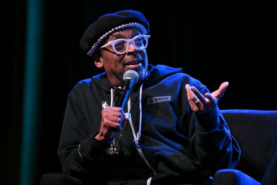 Spike Lee speaking into a microphone