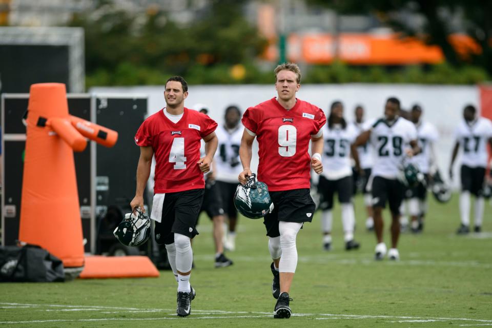 Then-Philadelphia Eagles quarterbacks G.J. Kinne, left, and Nick Foles jog off the field during training camp in 2013. Kinne had a six-year professional career in the NFL, CFL and USFL before getting into coaching.