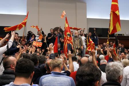 Protesters entered Macedonia's parliament after the governing Social Democrats and ethnic Albanian parties voted to elect an Albanian as parliament speaker in Skopje. Macedonia April 27, 2017. REUTERS/Ognen Teofilovski