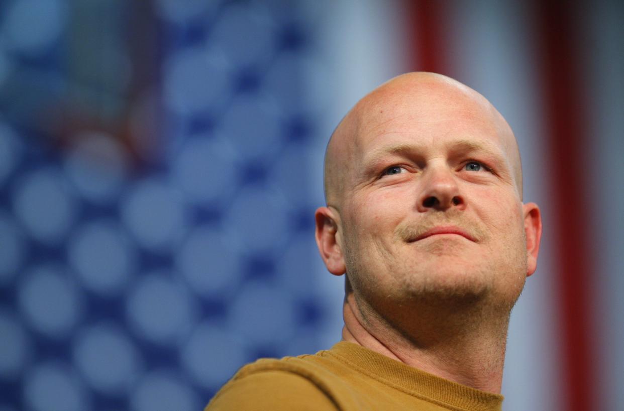 Joe Wurzelbacher, also known as Joe the Plumber, stands onstage at a campaign rally with U.S. Republican presidential nominee Senator John McCain in Mentor, Ohio in this file photo taken October 30, 2008. Wurzelbacher, a conservative, announced on Sunday that he recently had the fortune of being hired by a great company, Chrysler Corporation, where all workers must be United Automobile Workers union members. REUTERS/Brian Snyder/Files (UNITED STATES - Tags: POLITICS BUSINESS EMPLOYMENT)