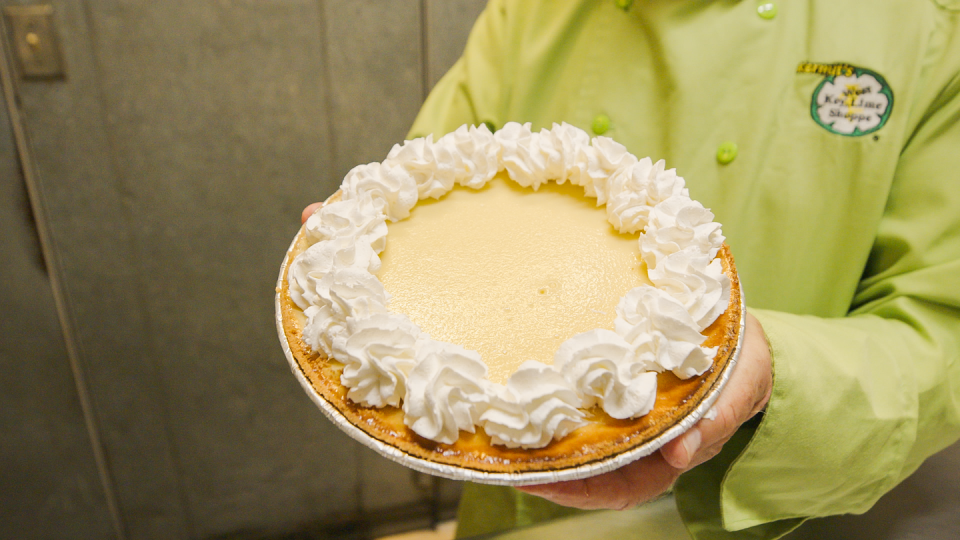 a person holding a cake