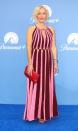 <p>Gillian Anderson shook up the Barbiecore trend by showing off this striped, cutout Jonathan Simkhai gown, which she paired with red Jimmy Choo heels and jewelry from Solange Azagury-Partridge.</p>