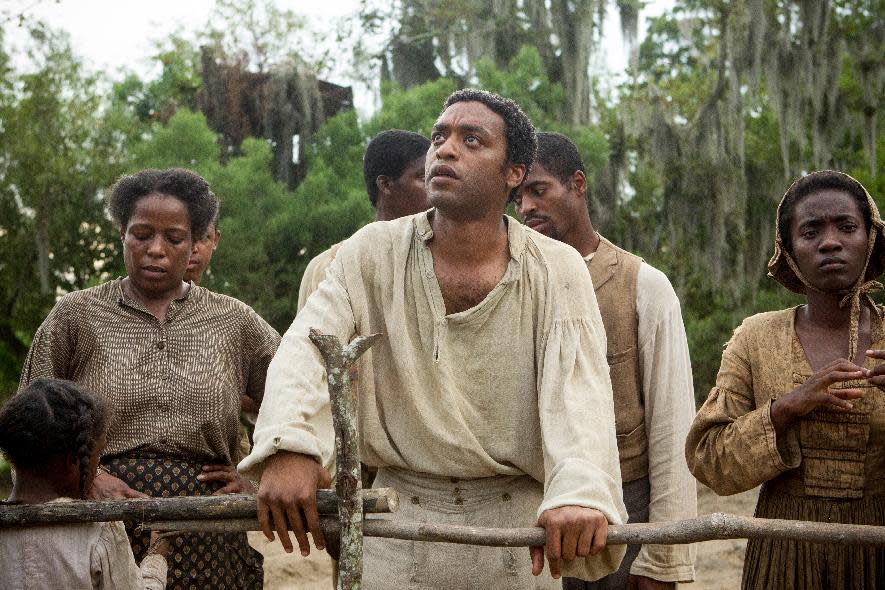 FILE - This file image released by Fox Searchlight shows Chiwetel Ejiofor, center, in a scene from "12 Years A Slave." (AP Photo/Fox Searchlight, Jaap Buitendijk)