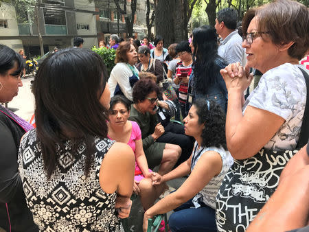 People react after an earthquake hit in Mexico City, Mexico September 19, 2017. REUTERS/Claudia Daut