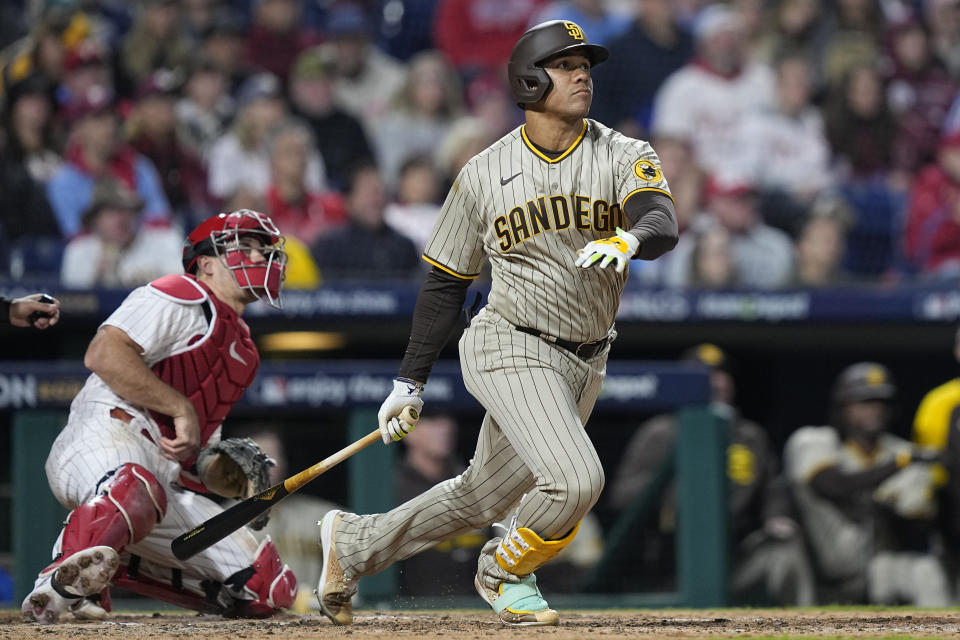 FILE - San Diego Padres right fielder Juan Soto watches his two-run home run during the fifth inning in Game 4 of the baseball NL Championship Series between the San Diego Padres and the Philadelphia Phillies on Saturday, Oct. 22, 2022, in Philadelphia. Outfielder Juan Soto agreed to a $23 million, one-year contract with the San Diego Padres on Friday, Jan. 13, 2023, a raise from his $17.1 million salary last season.(AP Photo/Matt Rourke, FIle)