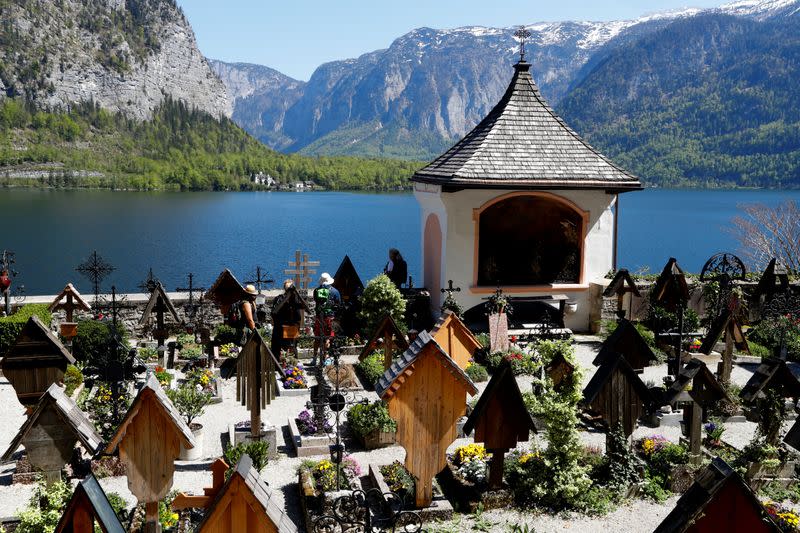 People walk in the cemetery of the city of Hallstatt