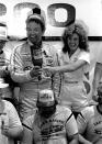 FILE - In this June 5, 1983, file photo, Hershel McGriff empties a bottle of Cold Duck over the head of crew member Snow Thornsberry with the help of Miss Winston, Becky Carter, after winning the Warner Hodgdon 200 NASCAR race at Riverside Raceway in Riverside, Calif. McGriff is a contender for NASCAR's 2021 Hall of Fame class, to be announced Tuesday, June 16, 2020. (AP Photo/Doug Pizac, File)