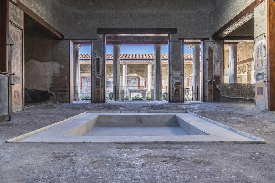 A view from inside the House of Vettii in Pompeii, Italy, looking out at the garden.