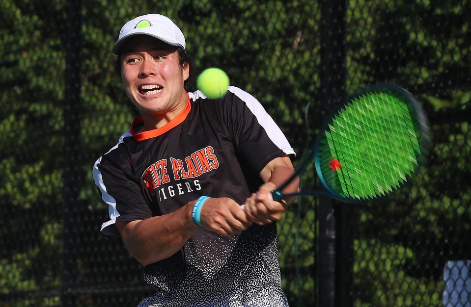 White Plains' Callum Markowitz returns a shot against Mamaroneck's Maxim Kalinin on his way to winning the Section 1 boys single tennis championship at Harrison High School May 22, 2024.