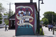 A mural honors Nashua Dodgers greats Don Newcombe and Roy Campanella, Tuesday, May 23, 2023, in Nashua, N.H. Holman Stadium in Nashua is being recognized for hosting the country's first racially integrated baseball team, the Nashua Dodgers, in 1946. The club was a minor league league affiliate of the Brooklyn Dodgers, which included Hall of Famer Roy Campanella and future Cy Young Award winner Don Newcombe. (AP Photo/Charles Krupa)