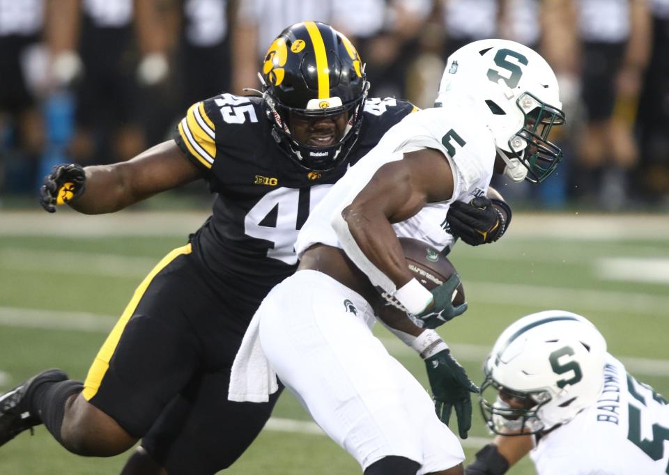 Iowa defensive lineman Deontae Craig makes a tackle against Michigan State running back Nathan Carter during the first half of MSU's 26-16 loss Saturday, Sept. 30, 2023, in Iowa City, Iowa.