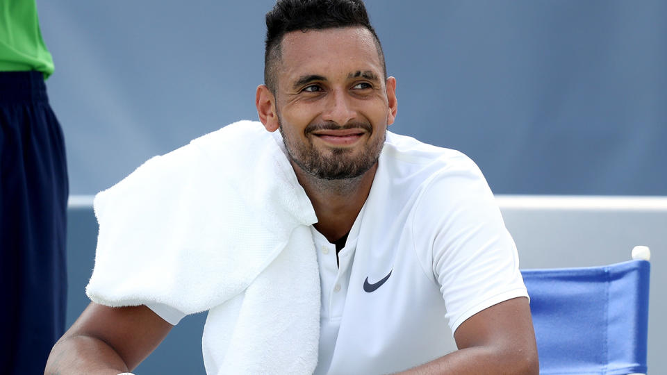 Nick Kyrgios of Austraila cools down between games. (Photo by Matthew Stockman/Getty Images)