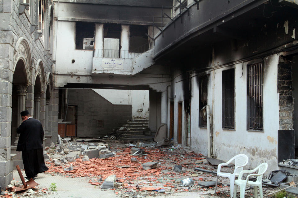 This photograph made on a military-led media tour shows damage inside the Um al-Zinar church in the old city of Homs, Syria on Friday, May 9, 2014, where bulldozers cleared rubble from the streets of battle-scarred districts in the central Syrian city after government troops entered the last rebel-held neighborhoods as part of an agreement that also granted opposition fighters safe exit from the city. (AP Photo)