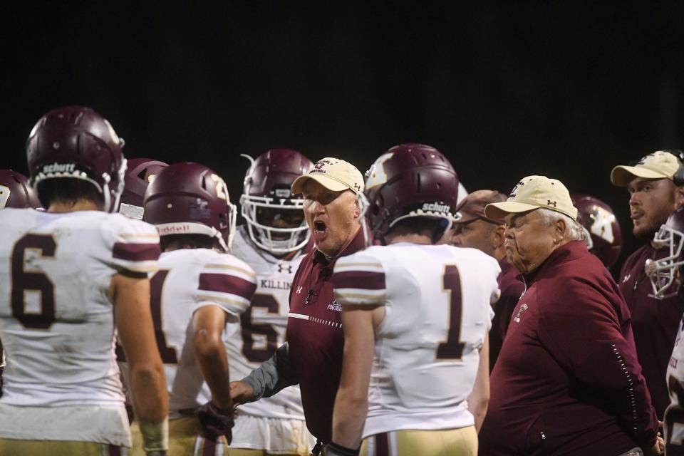Killingly and head football coach Chad Neal, center, make their seventh consecutive appearance in the state playoffs on Tuesday at Morgan Field in Killingly.