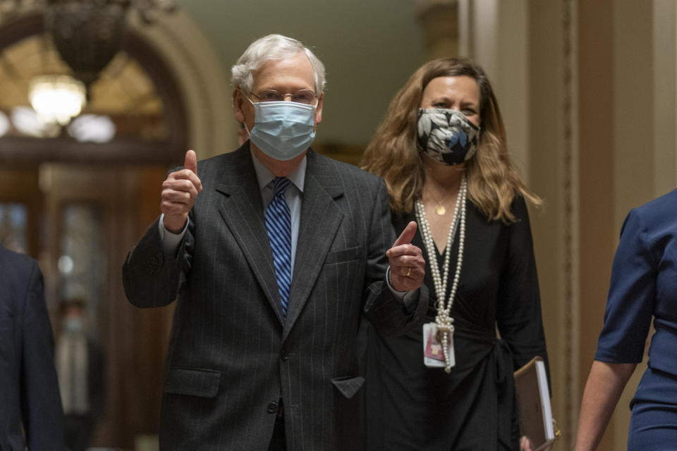 Senate Majority Leader Mitch McConnell of Ky., flashes his thumbs up as he leaves the chamber at the Capitol after a vote confirming Amy Coney Barrett to the Supreme Court, Monday, Oct. 26, 2020, in Washington. (AP Photo/Manuel Balce Ceneta)